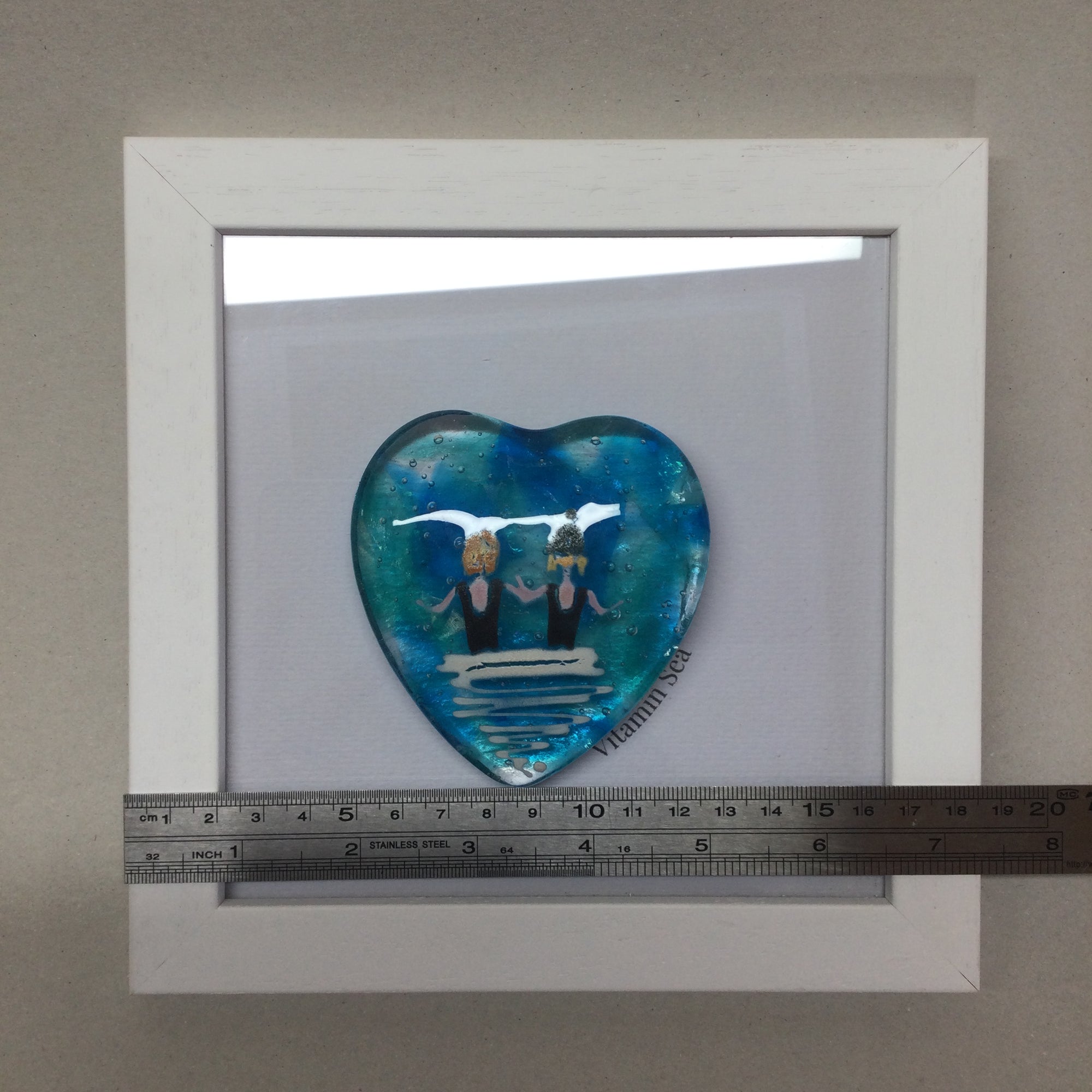 Limited Edition Framed Fused Glass Heart - Pair of Sea Swimmers in Black Costumes