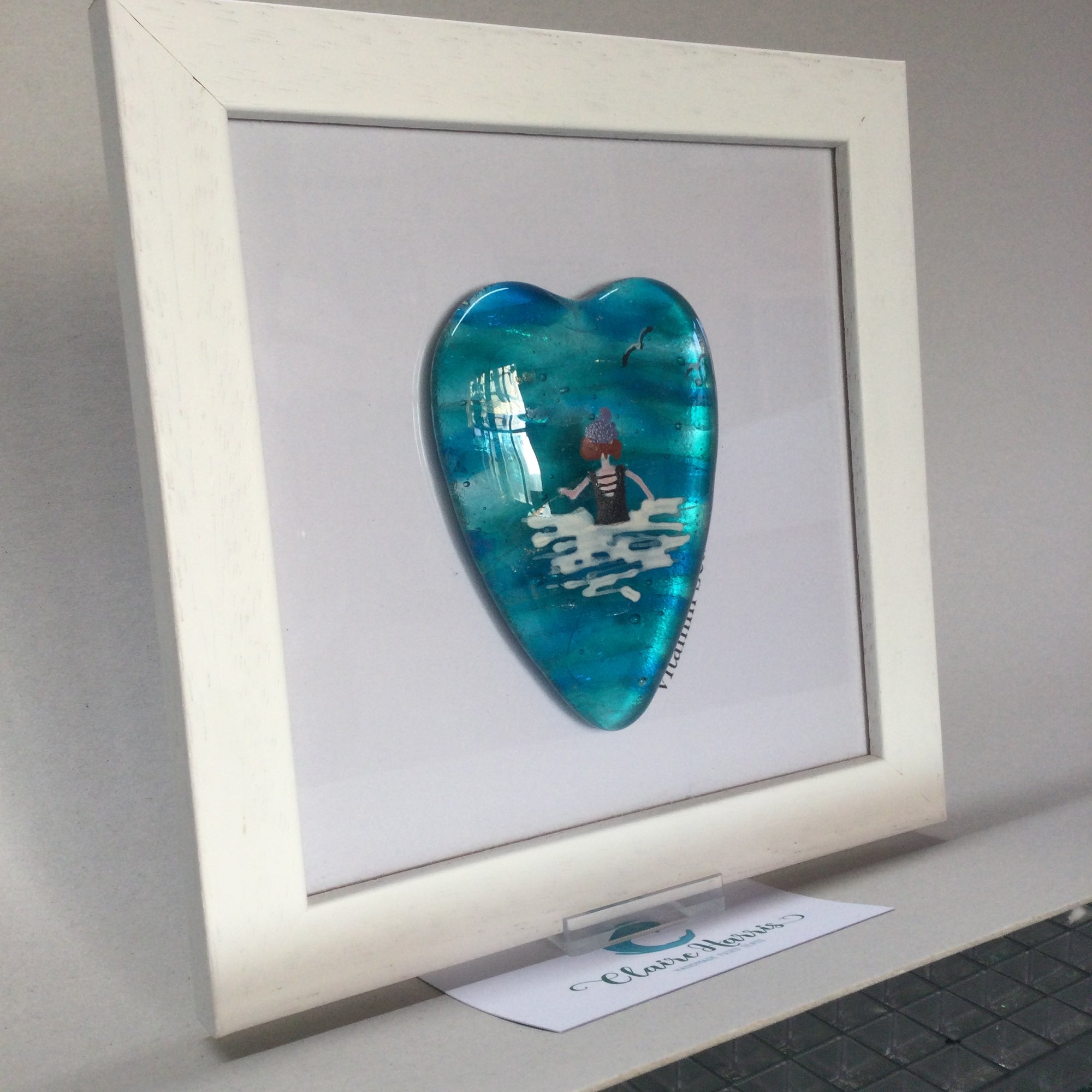 Limited Edition Framed Fused Glass Sea Swimmer Heart - Black costume with Purple Bobble Hat