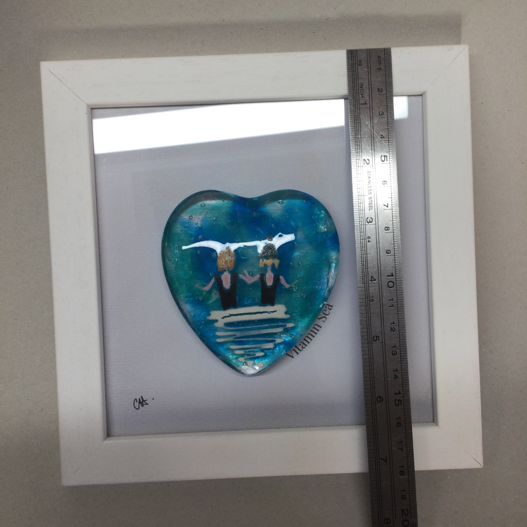 Limited Edition Framed Fused Glass Heart - Pair of Sea Swimmers in Black Costumes