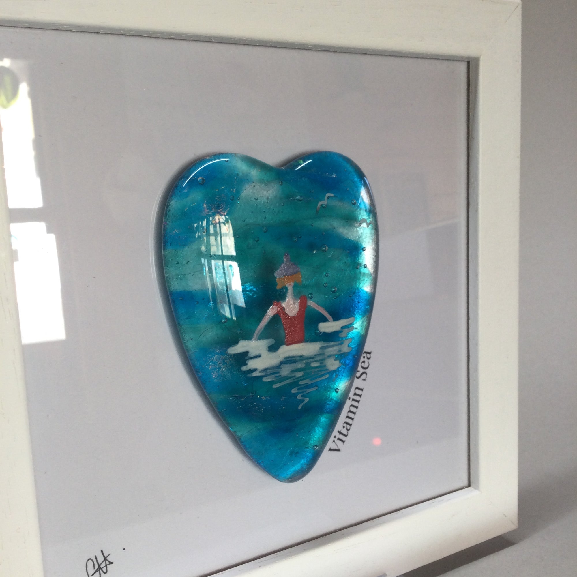 Limited Edition Framed Fused Glass Sea Swimmer with Red Costume, Purple Bobble Hat