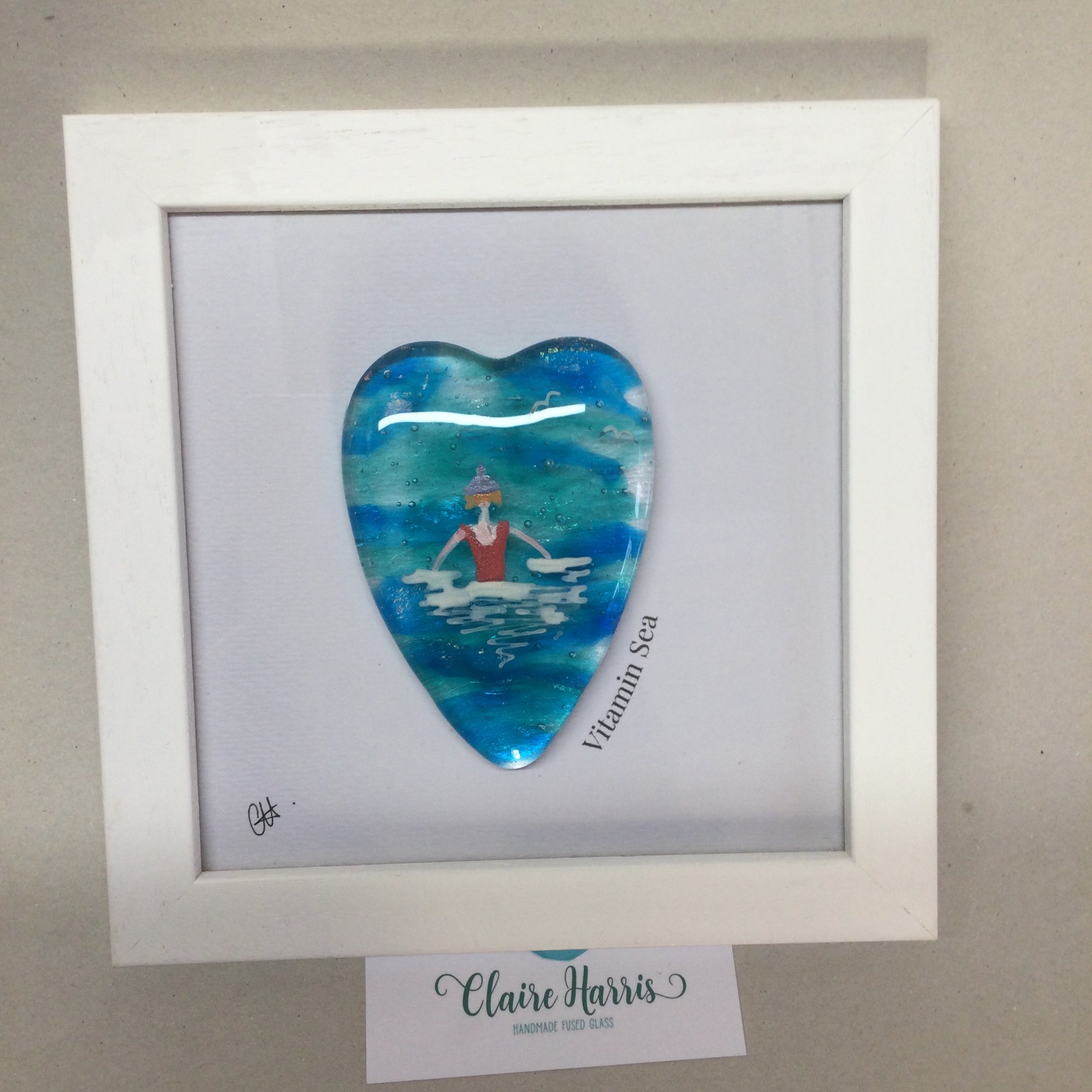 Limited Edition Framed Fused Glass Sea Swimmer with Red Costume, Purple Bobble Hat