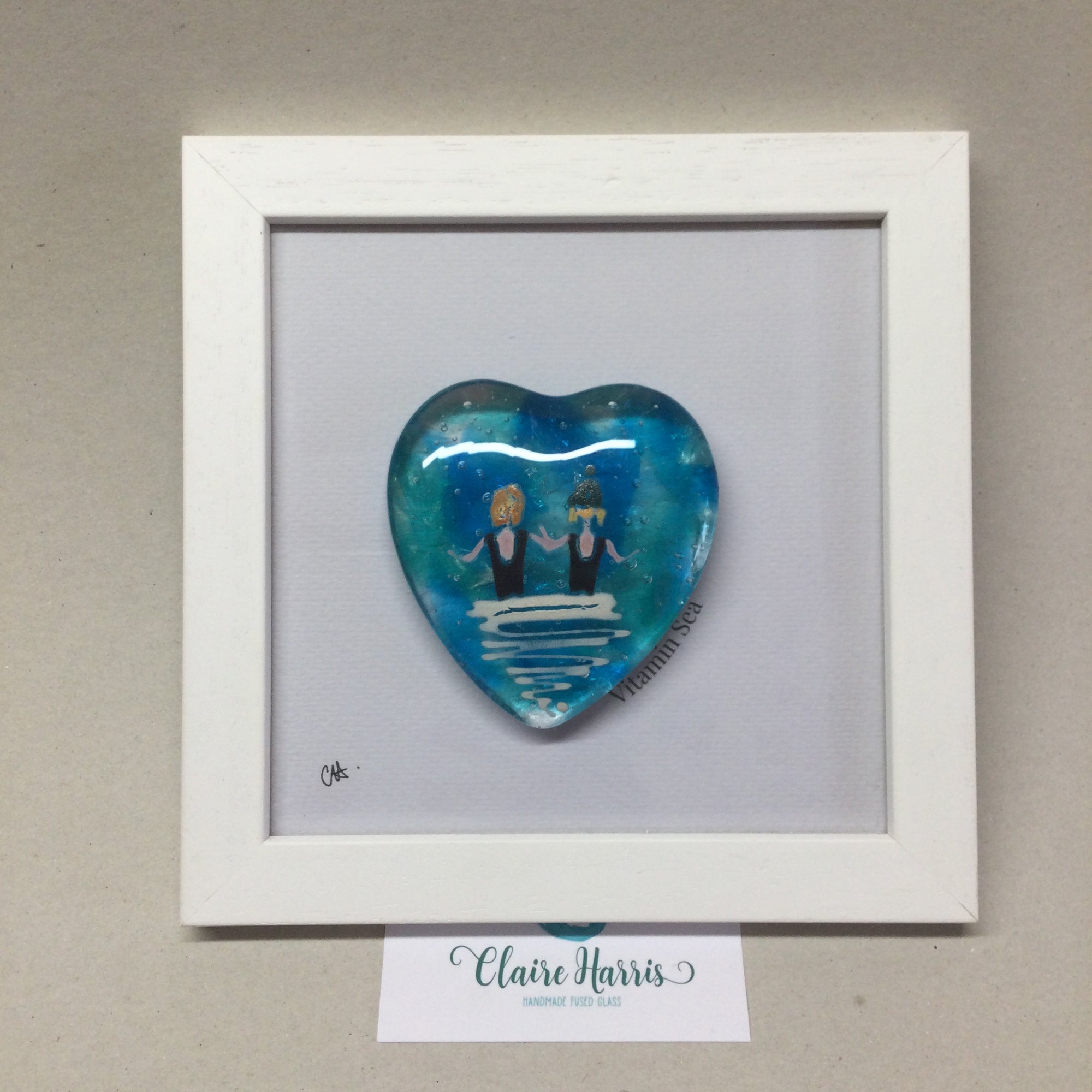 Limited Edition Framed Fused Glass Heart - Pair of Sea Swimmers in Black Costumes