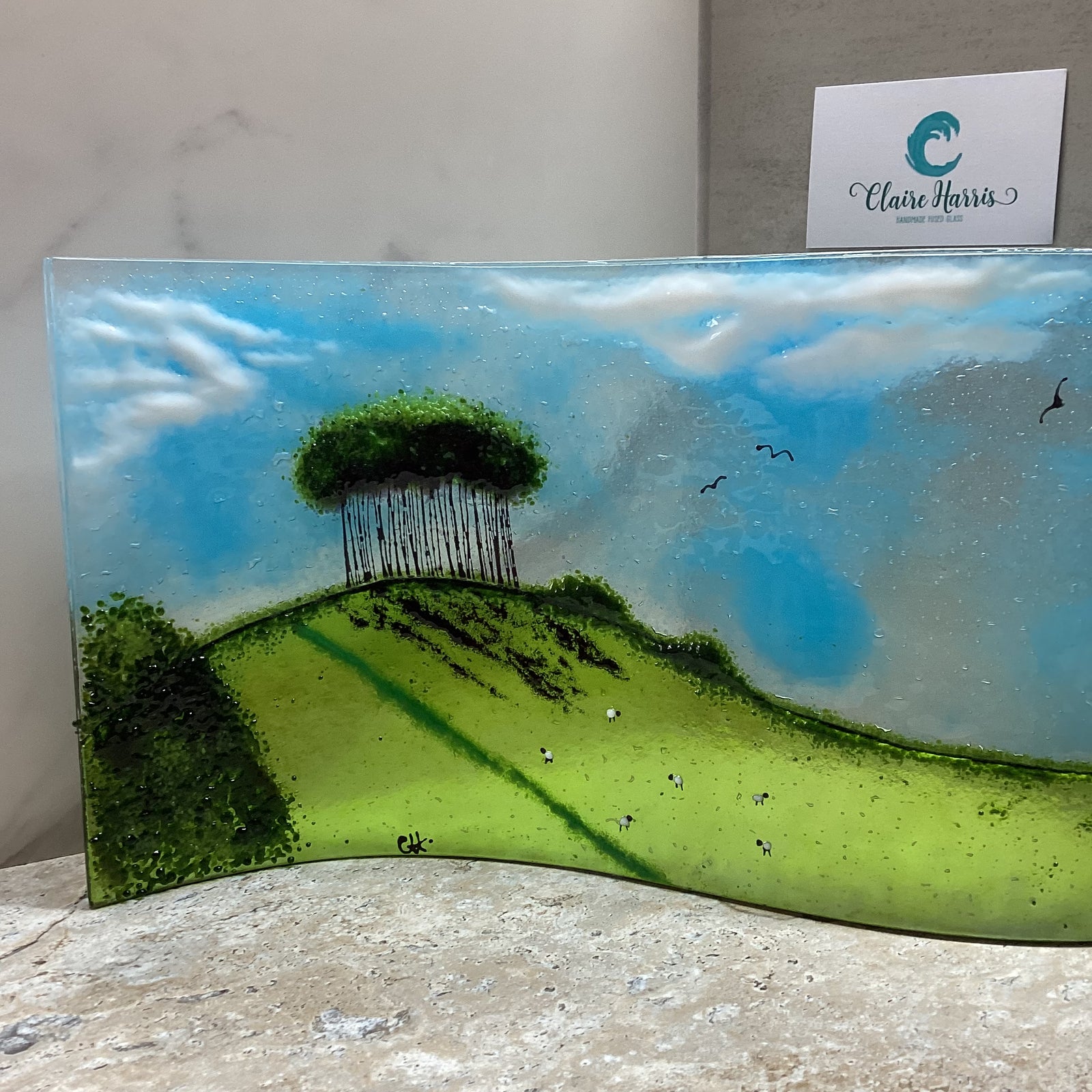 Fused Glass Jumbo Nearly Home Trees, main product front view with a business card.