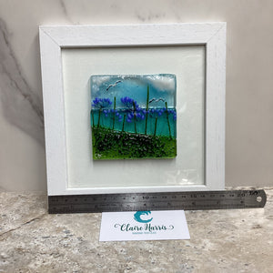 Fused Glass Square Framed Agapanthus, with a ruler to demonstrate the length of the piece.
