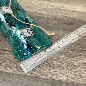Fused Glass large hanger featuring a Trio of Seals, close-up view of a ruler demonstrating the width of the product.