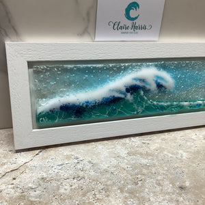 Fused Glass regular sized framed Light Aqua Crashing Wave with a close-up view of the left of the design.