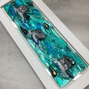Fused Glass regular sized Trio of Seals piece, flat lay image showing the iridescence and texture of the piece.