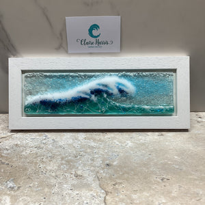Fused Glass regular sized framed Light Aqua Crashing Wave, front view of the product with a business card.