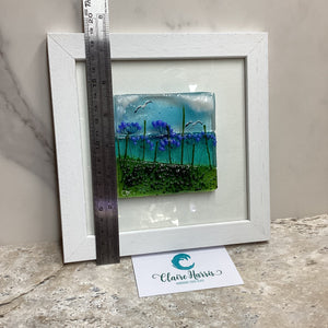 Fused Glass Square Framed Agapanthus, with a ruler to demonstrate the height of the piece.